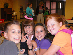 4 children enjoying fellowship at a table