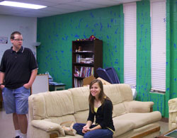 Two students hanging out in the youth room